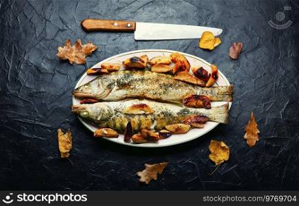 Pike perch baked with autumn fruits.Fish seasonal recipe. Baked dietary fish with quince
