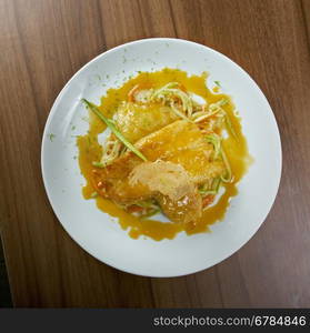 Pike-perch fillet with vegetables and pasta.