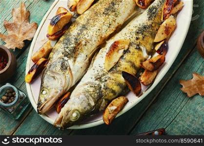Pike perch fried with autumn fruits.Dietary product. Baked dietary fish with quince