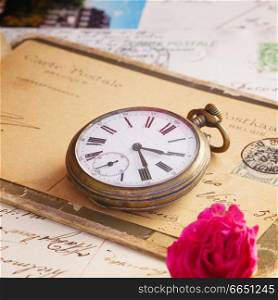 pil of old letters  and antique  clock