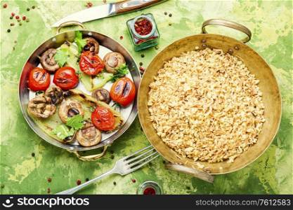 Pilaf, a dish of oriental cuisine.Turkish pilaf with grilled vegetables. Turkish rice with vermicelli