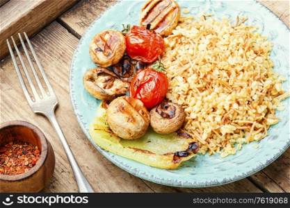Pilaf, a dish of oriental cuisine.Turkish pilaf with grilled vegetables. Turkish rice with vermicelli