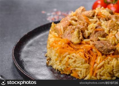 Pilaf or pilau with chicken, traditional uzbek hot dish of boiled rice, chicken meat, vegetables and spices on plate. Pilaf or pilau with chicken, traditional uzbek hot dish of boiled rice and chicken meat
