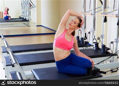 Pilates reformer woman mermaid exercise workout at gym