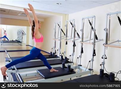 Pilates reformer woman russian split exercise workout at gym indoor