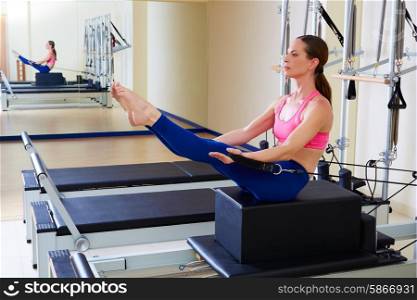 Pilates reformer woman short box teaser exercise workout at gym indoor