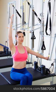 Pilates reformer woman side push through exercise workout at gym indoor