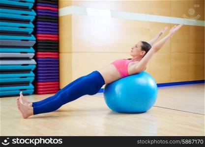 Pilates woman abdo fitball exercise workout at gym indoor swiss ball