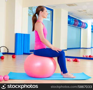 Pilates woman fitball swiss ball exercise workout at gym indoor