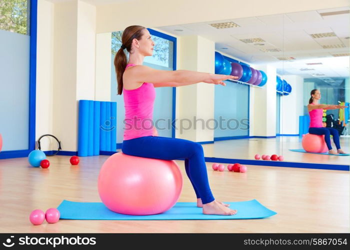 Pilates woman fitball swiss ball exercise workout at gym indoor