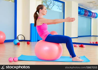 Pilates woman fitball swiss ball exercise workout at gym indoor