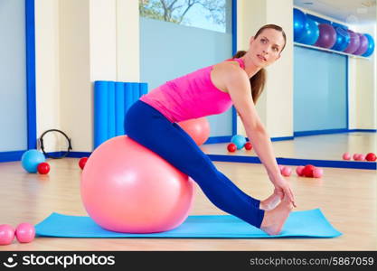 Pilates woman fitball swiss ball exercise workout at gym indoor