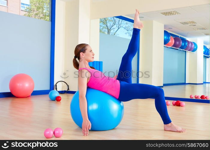 Pilates woman fitball swiss ball exercise workout at gym indoor