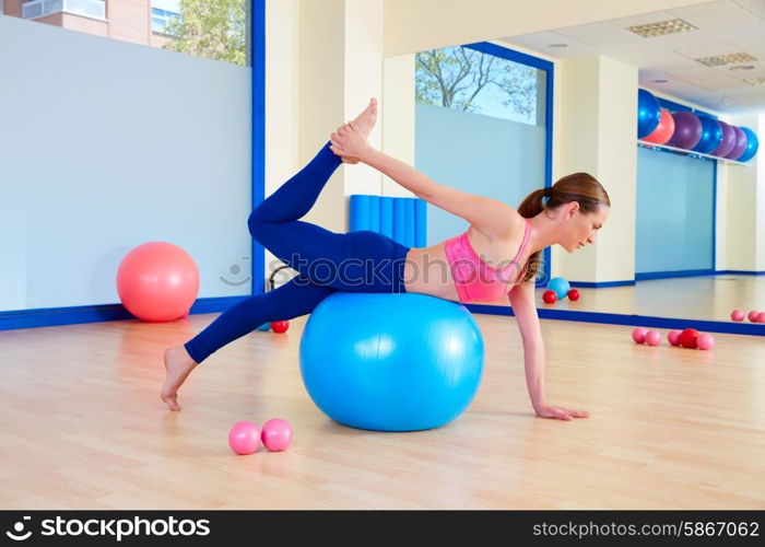 Pilates woman fitball swiss ball exercise workout at gym indoor