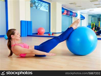 Pilates woman hundred fitball exercise workout at gym indoor swiss ball