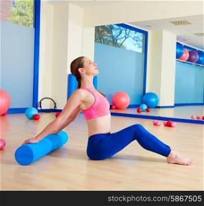 Pilates woman roller exercise workout at gym indoor