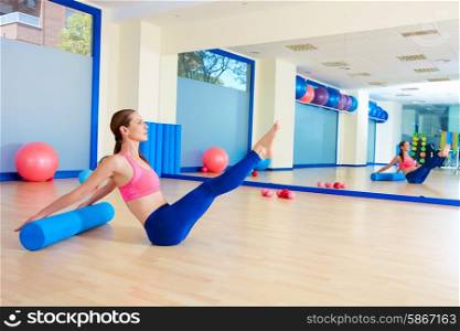Pilates woman roller teaser roll exercise workout at gym indoor