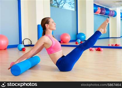 Pilates woman roller teaser roll exercise workout at gym indoor