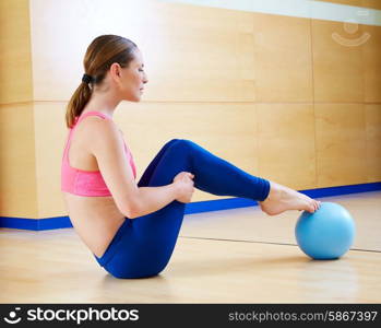 Pilates woman stability ball exercise workout at gym indoor