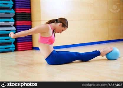 Pilates woman stability ball exercise workout at gym indoor