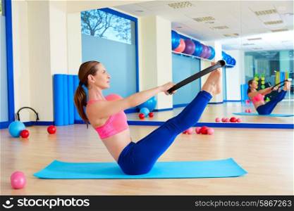Pilates woman teaser magic ring exercise workout at gym indoor