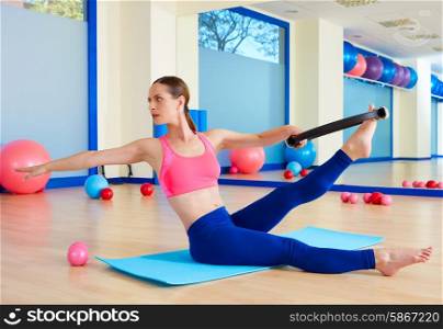 Pilates woman twist magic ring exercise workout at gym indoor
