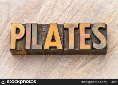 pilates - word abstract in wood type. pilates - word abstract in vintage letterpress wood type