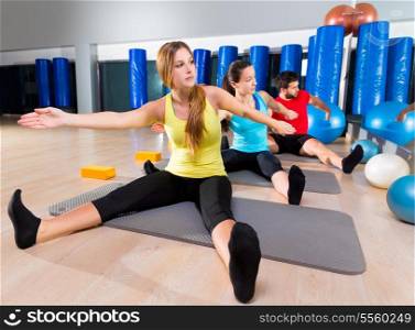 Pilates Yoga training exercise in fitness gym people group