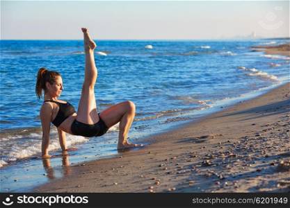 Pilates yoga workout exercise outdoor on the beach sand