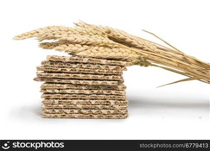 Pile Crackers and wheat cereal crops white isolated