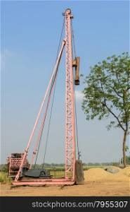 Pile driver at construction site