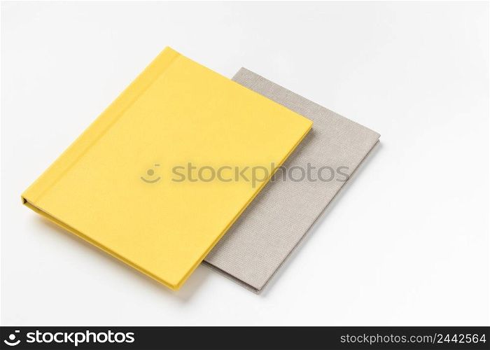Pile multicolor hardcover books on white background. book album on a white background