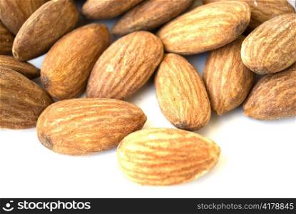 pile of almond nuts isolated on white