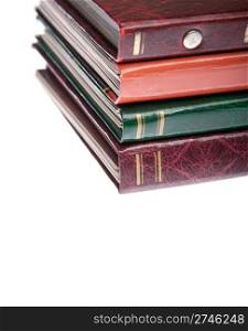 pile of antique photo albums isolated on white background