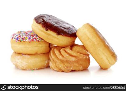 Pile of assorted donuts isolated on white background