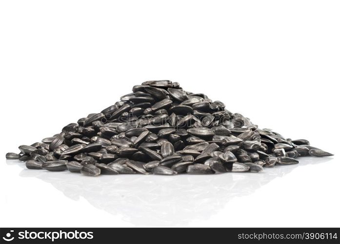 pile of black sunflower seeds isolated on a white background