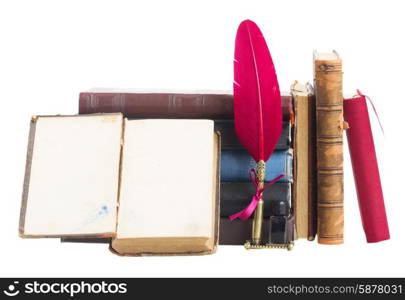 Pile of books. Old books with red feather pen isolated on white background