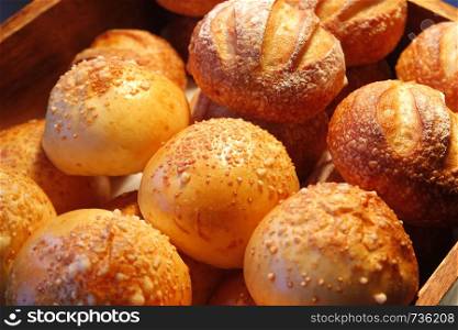 pile of bread roll on buffet line