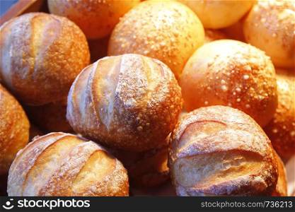 pile of bread roll on buffet line