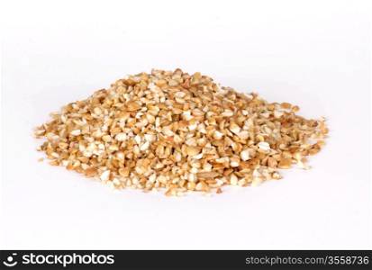 Pile of buckwheat groats isolated on white background