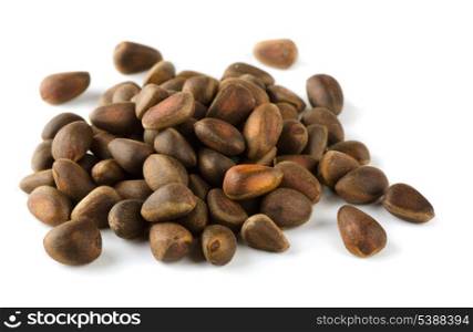 Pile of cedar nuts isolated on white