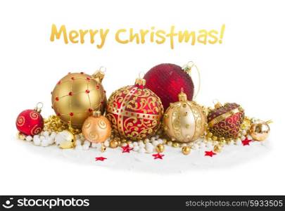 Pile of christmas balls in gold and red colors on snow isolated on white background. Pile of Christmas balls