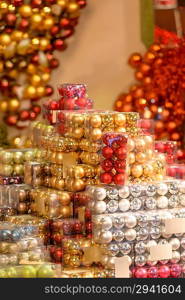 Pile of Christmas baubles in plastic boxes in decoration store