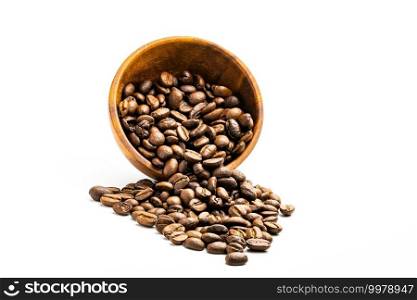 Pile of coffee beans in wooden bowl on white background with clipping path.