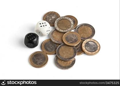 pile of coins and dice isolated on a white background