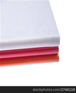 pile of colored notebooks (isolated on white background)