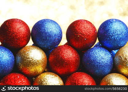 Pile of colorful Christmas balls with blurred background