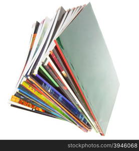 Pile of colorful magazines isolated over white background