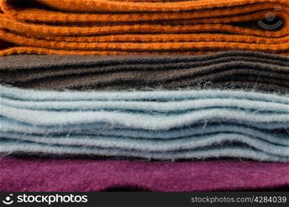 Pile of colorful scarves background.