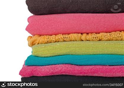 Pile of colorful scarves over white background.